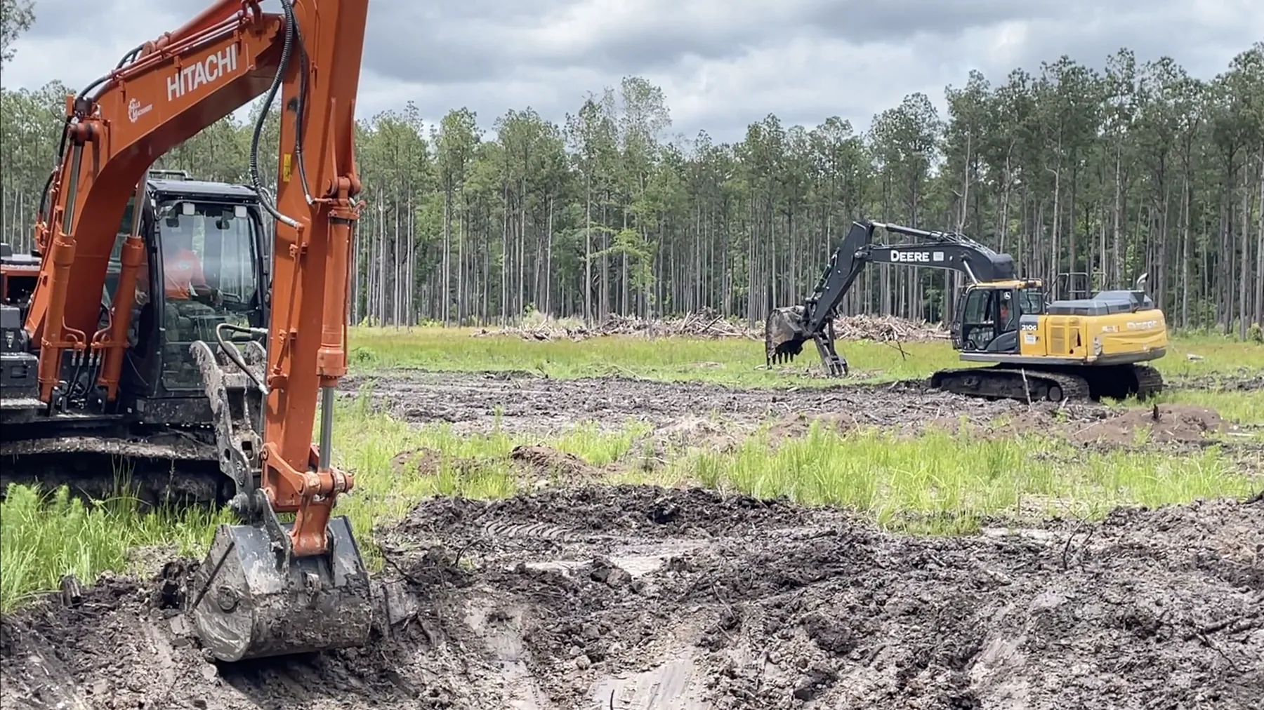 Cleared homesite ready for development with pines around the edge